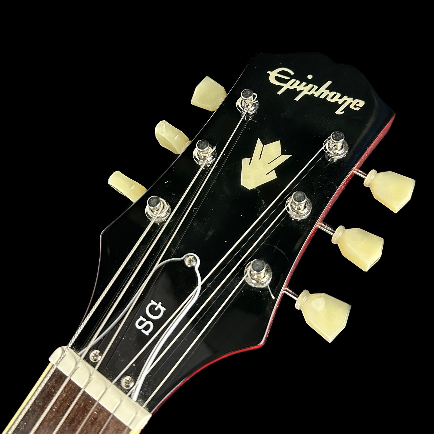 Front of headstock of Used Epiphone SG Standard Cherry.
