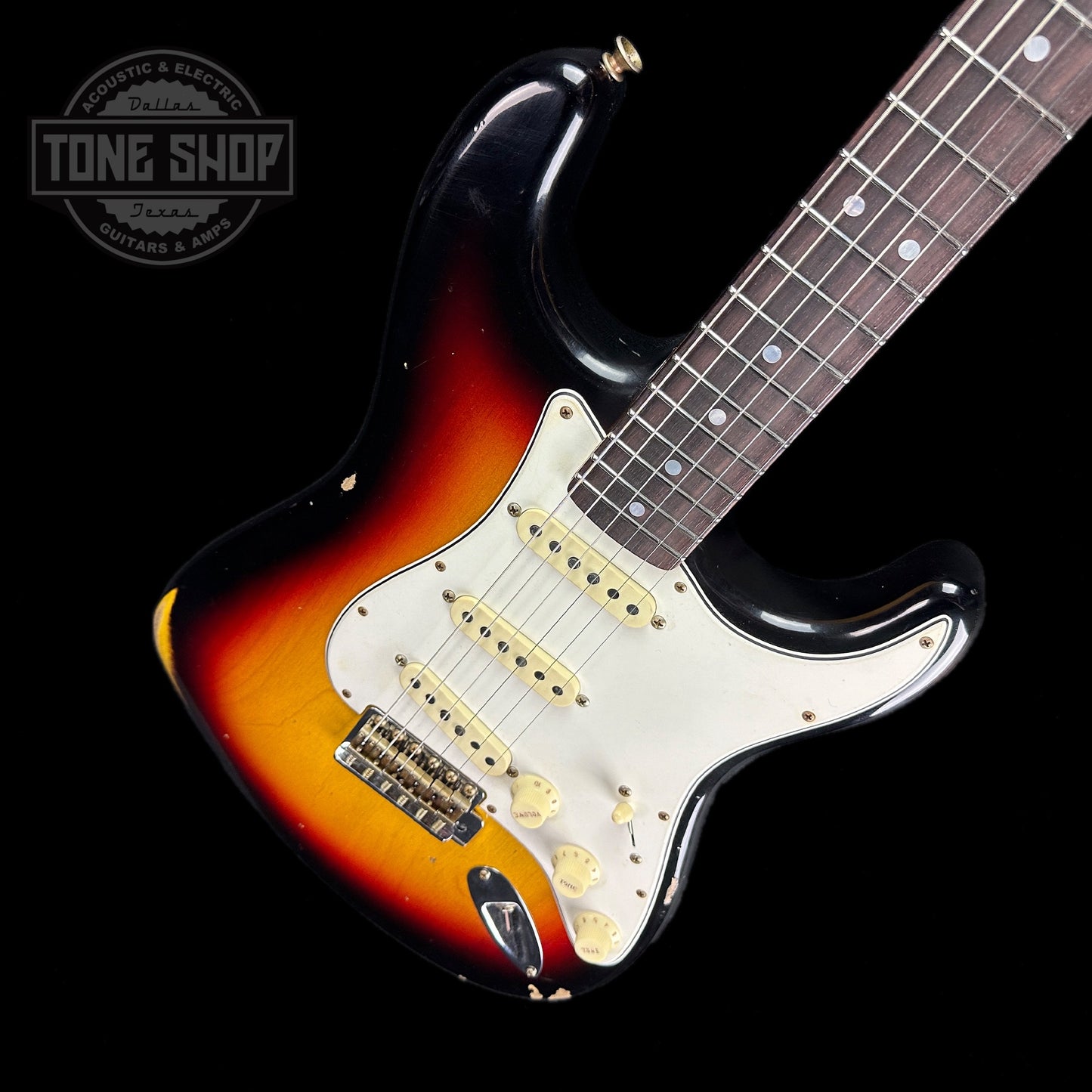 Front angle of Fender Custom Shop Limited Edition Late 64 Strat Relic Target 3 Color Sunburst.