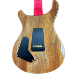 Wooden electric guitar body with a pink strap on a white background