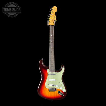 Electric guitar with a sunburst finish on a black background, featuring the Tone Shop logo.