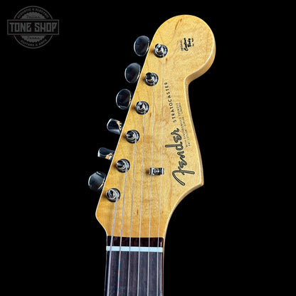 Fender Stratocaster guitar headstock on a black background with 'Tone Shop' logo.