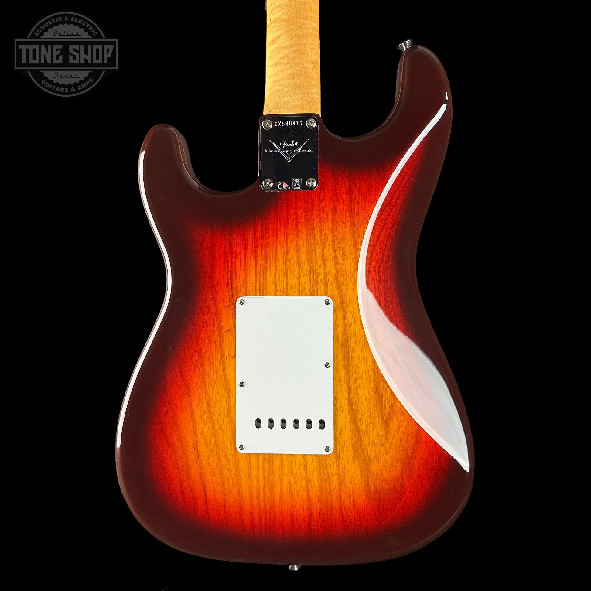 Electric guitar with a sunburst finish on a black background, featuring the Tone Shop logo.