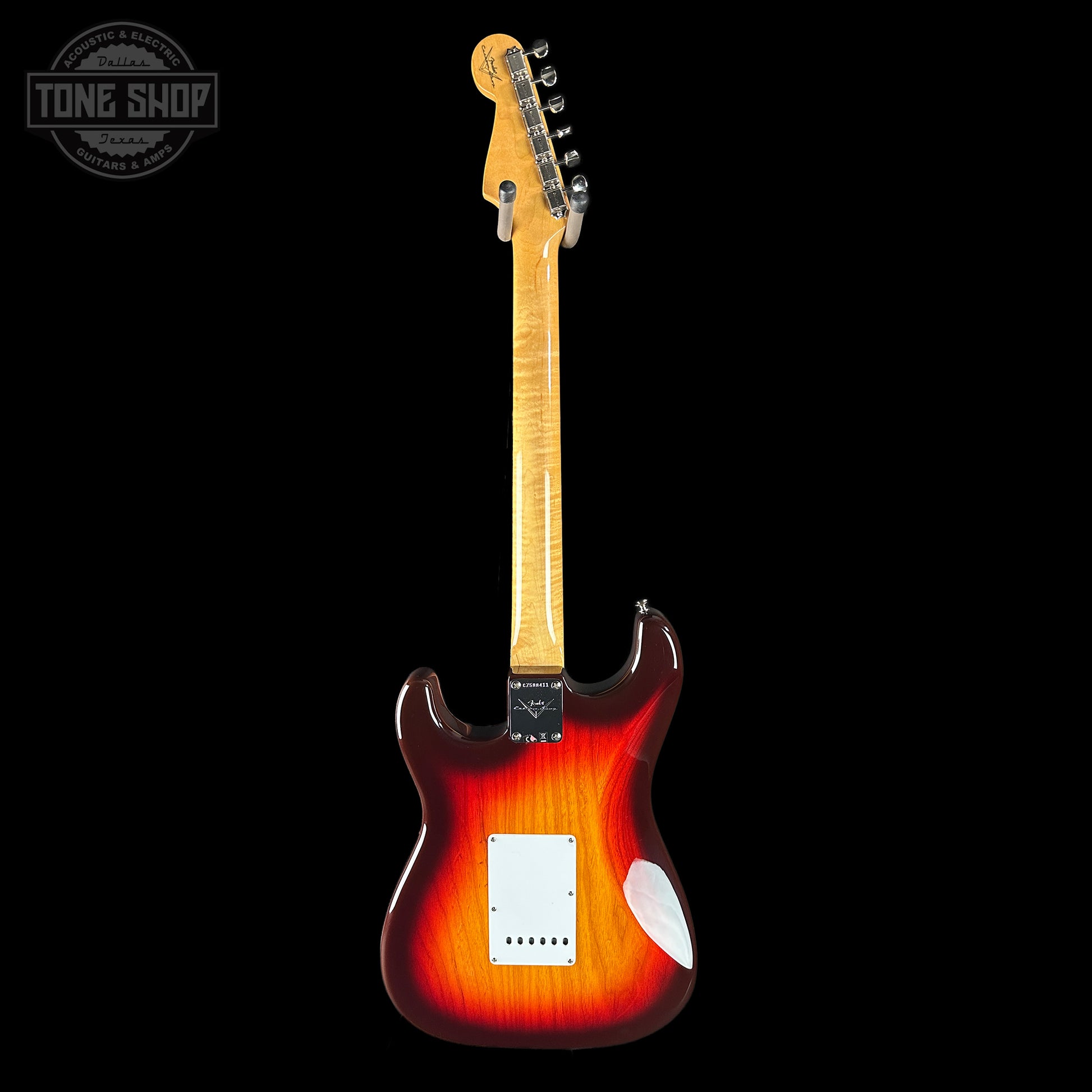 Electric guitar with a sunburst finish on a black background, featuring the Tone Shop logo.