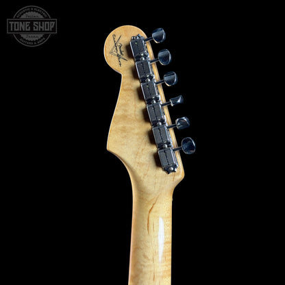 Guitar headstock with tuning pegs on a black background, featuring the Tone Shop logo.
