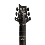 Close-up of a black electric guitar neck with headstock on a white background