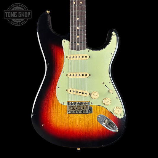 Electric guitar with a sunburst finish on a black background, featuring the Tone Shop logo.