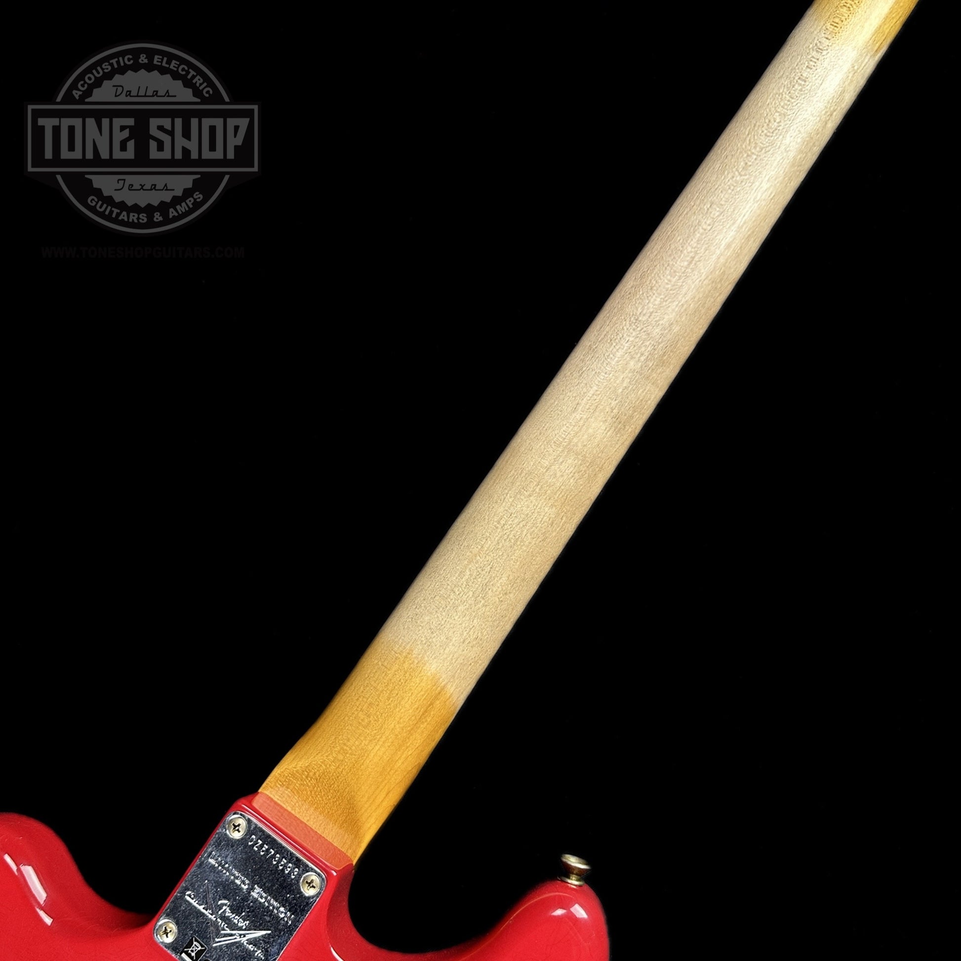 Back of neck of Fender Custom Shop Limited Edition Bass VI Journeyman Relic Aged Dakota Red.