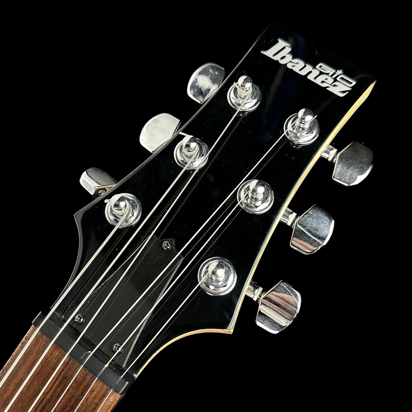 Front of headstock of Used Ibanez GAX70 Black.