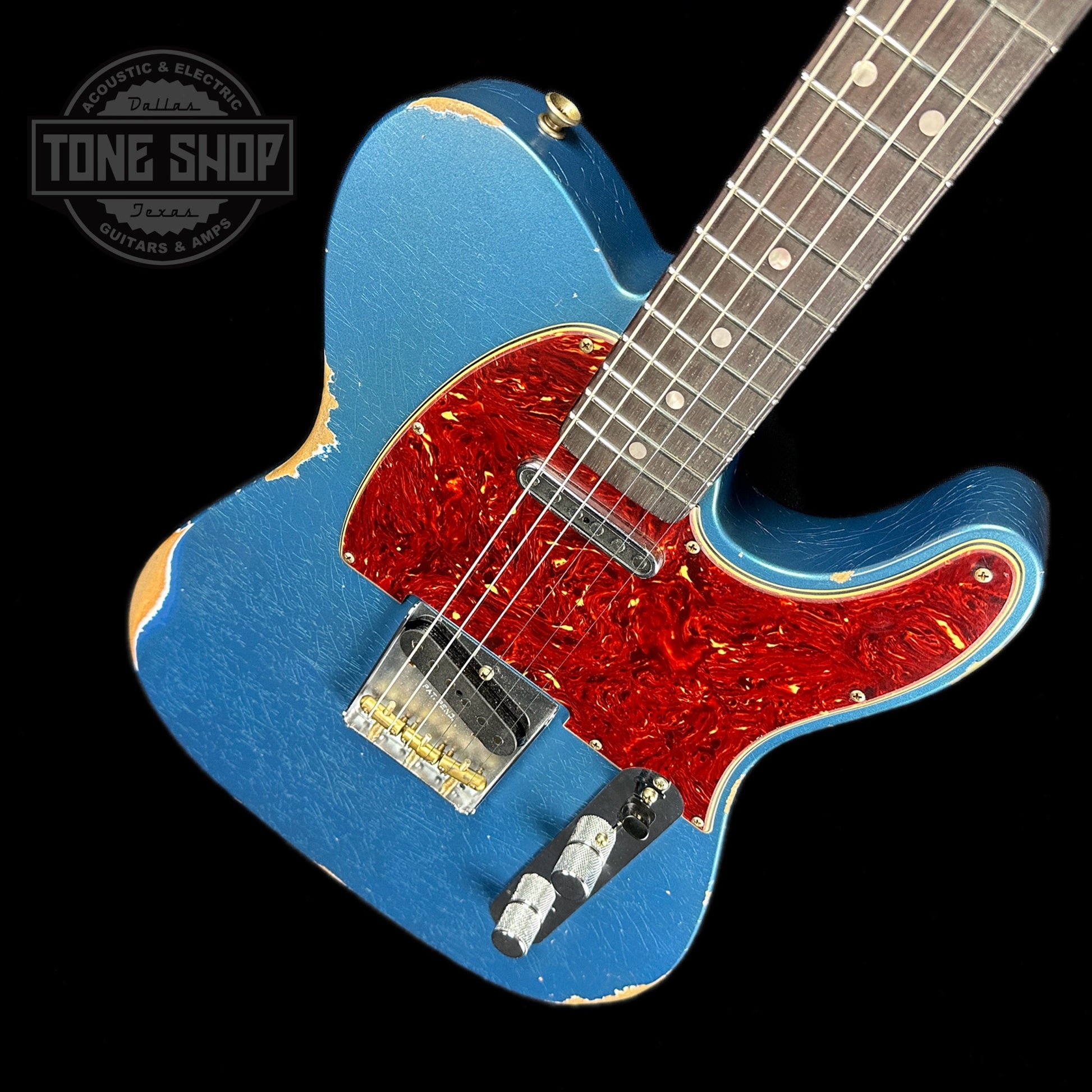 Front angle of Fender Custom Shop Limited Edition '64 Tele Relic Aged Lake Placid Blue.