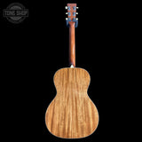 Martin Custom Shop 00L-14 All-Mahogany Back view of a wooden acoustic guitar on a black background with 'Tone Shop' branding.