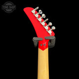 Red guitar headstock with tuning pegs on a black background, featuring 'Tone Shop' logo.