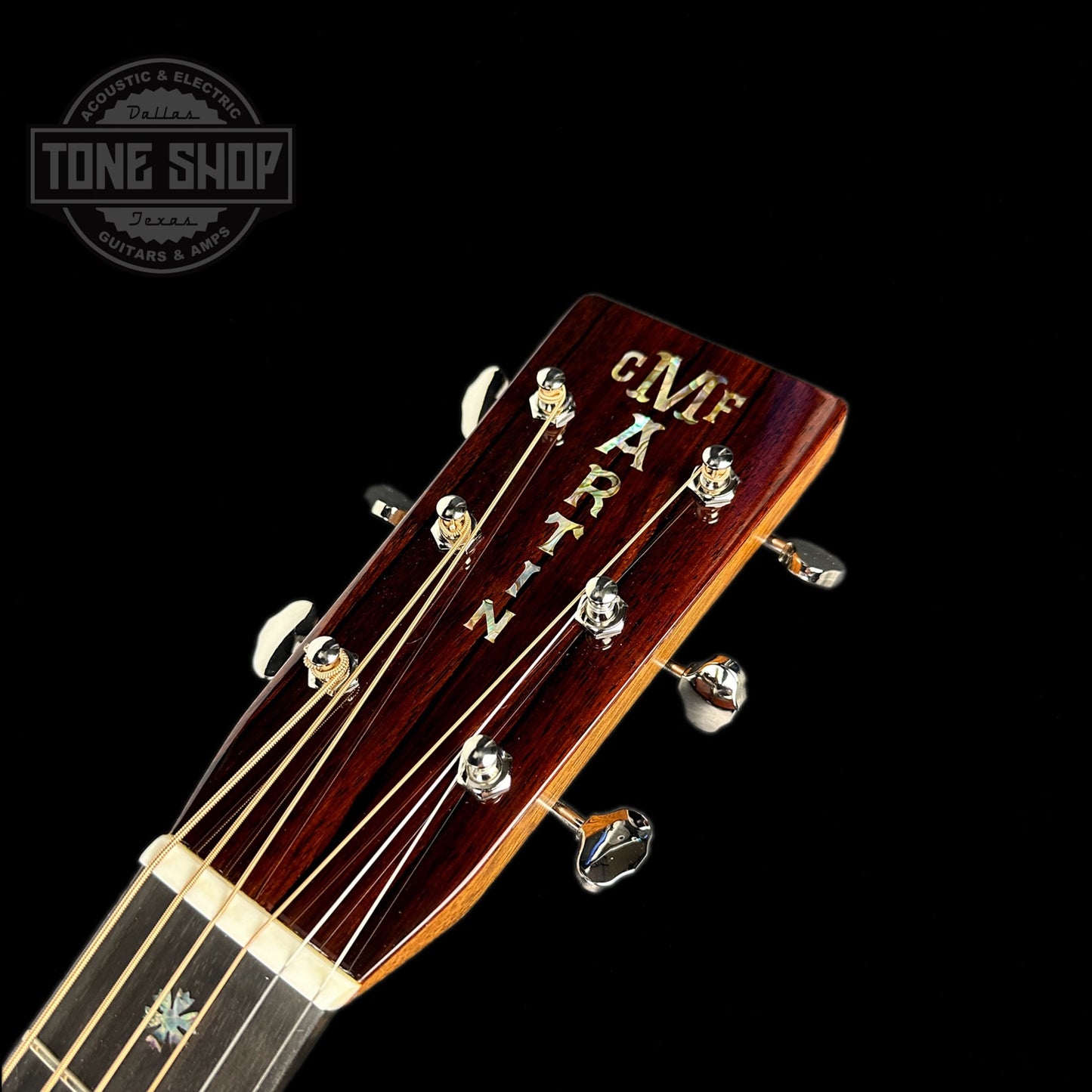 Front of headstock of Martin Custom Shop Dread Adirondack/Cocobolo.