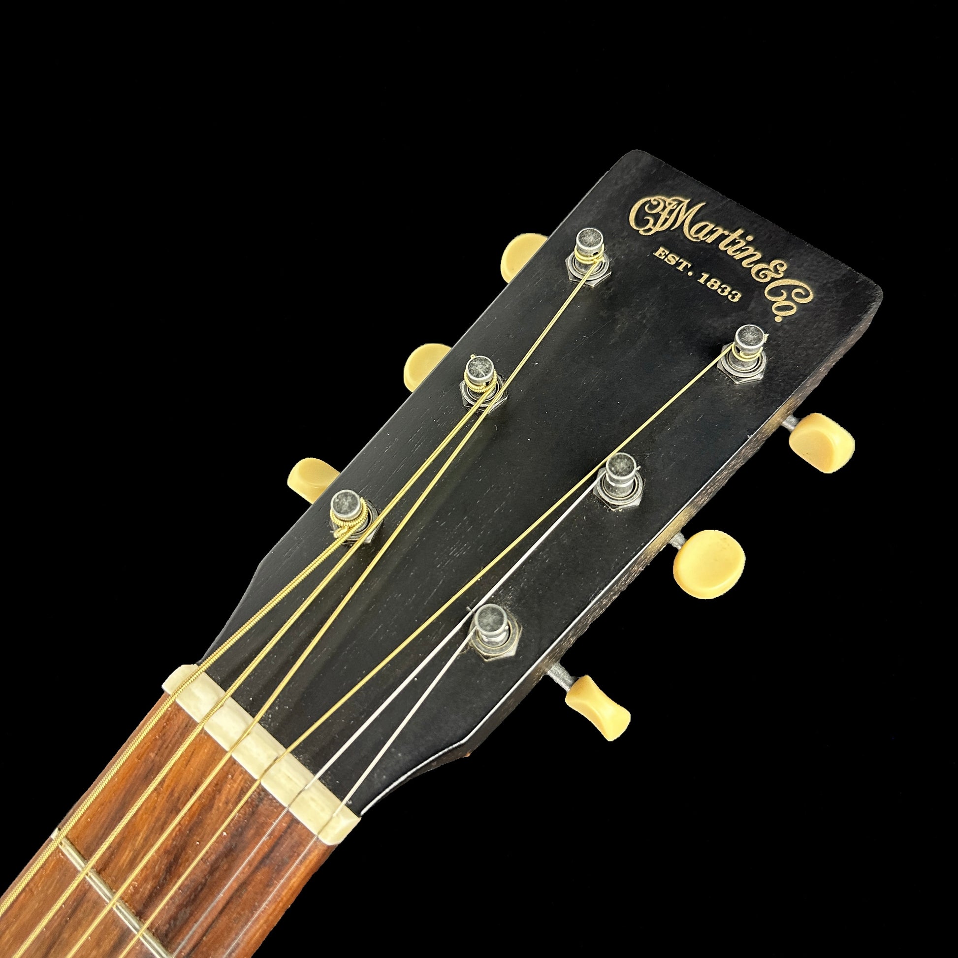 Front of headstock of Used Martin 00L-17 Black Smoke.