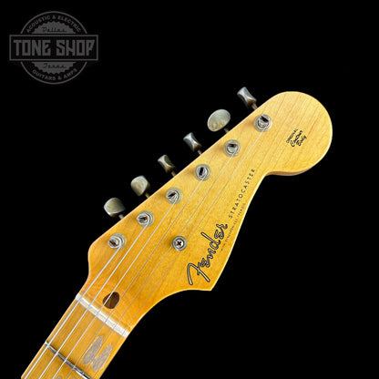 Front of headstock of Fender 1956 Stratocaster Journeyman Relic Maple Neck Wide-Fade 2-Color Sunburst.