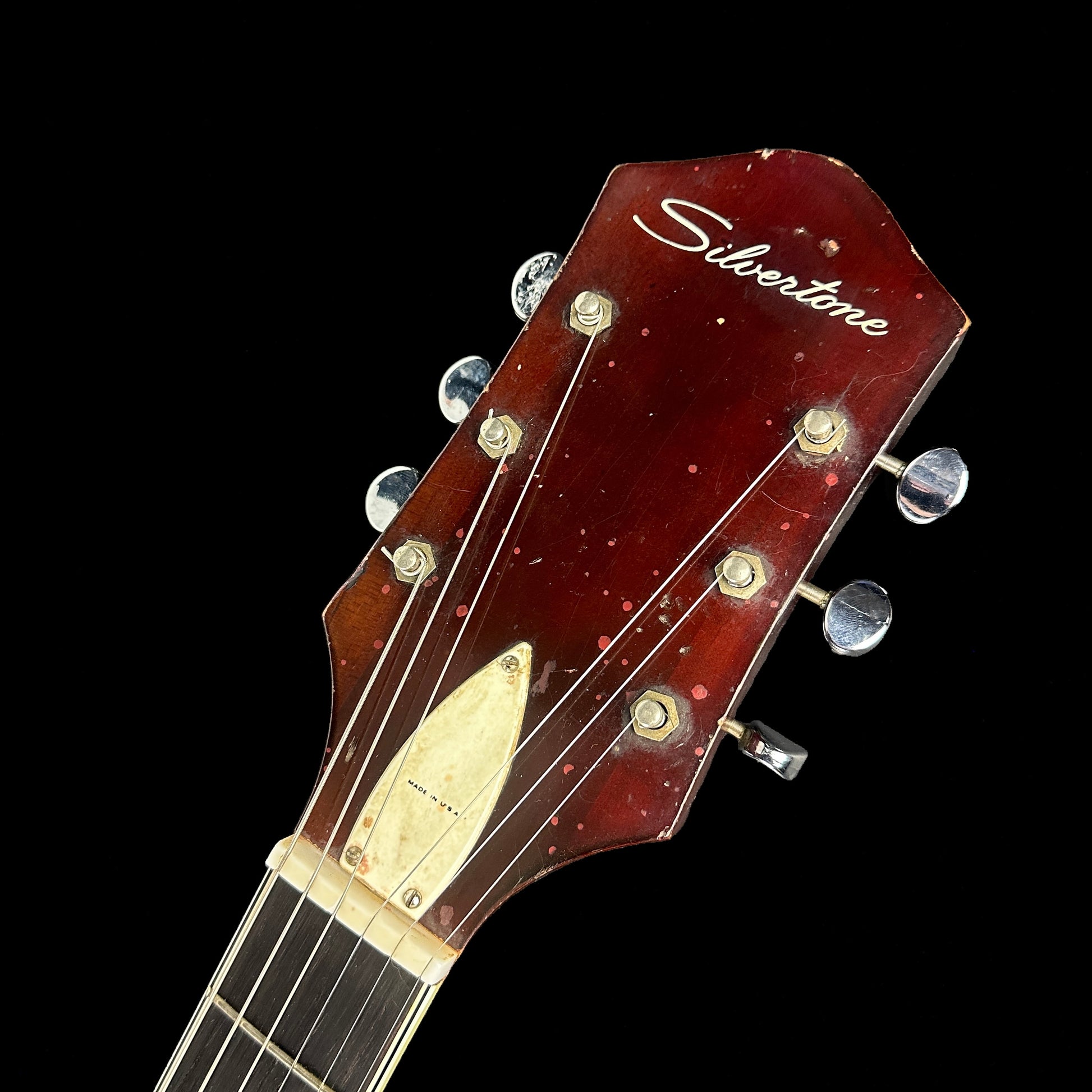 Front of headstock of Vintage Silvertone 1454 Double Cut Redburst.