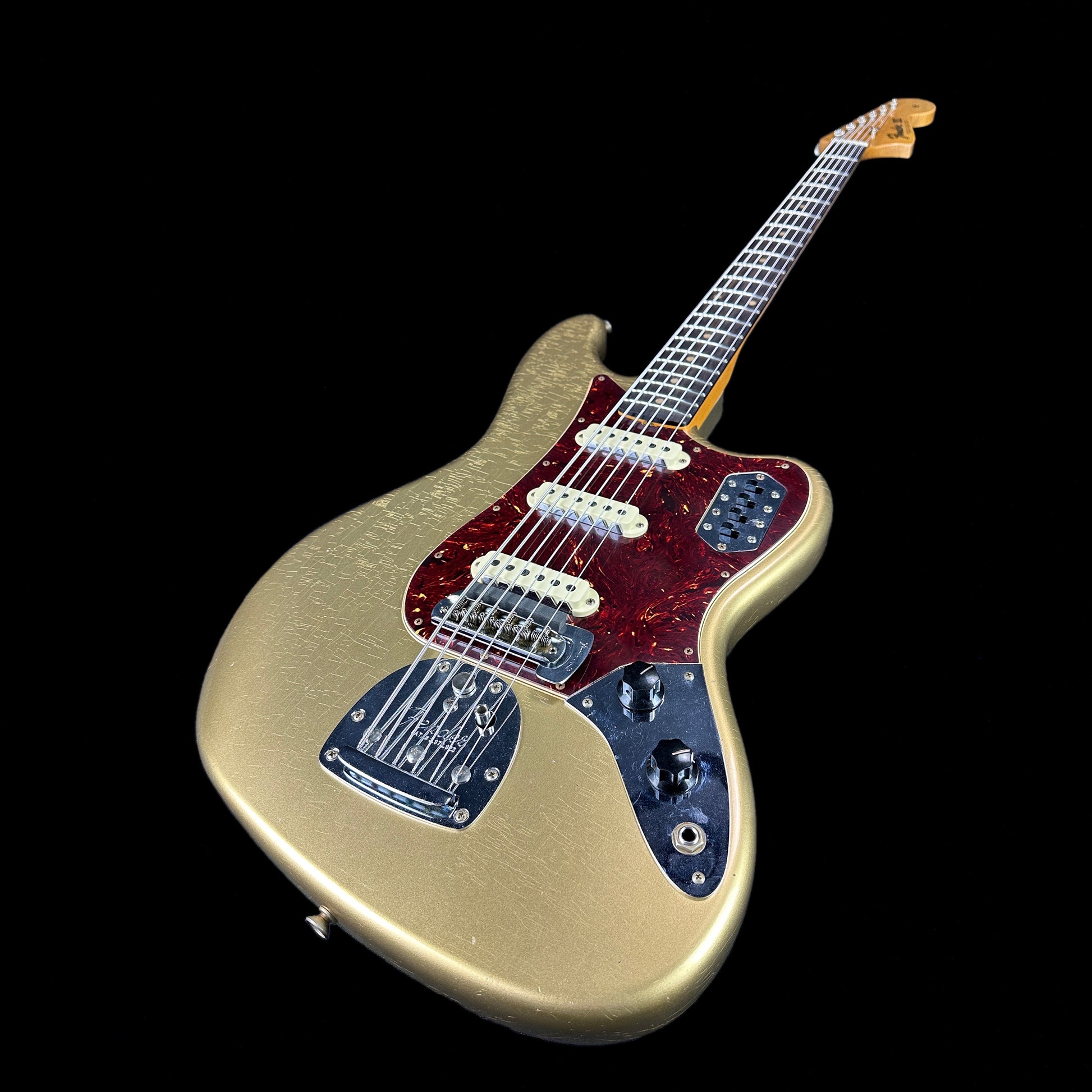 Front angle of Fender Custom Shop Limited Edition Bass VI Journeyman Relic Aged Aztec Gold.