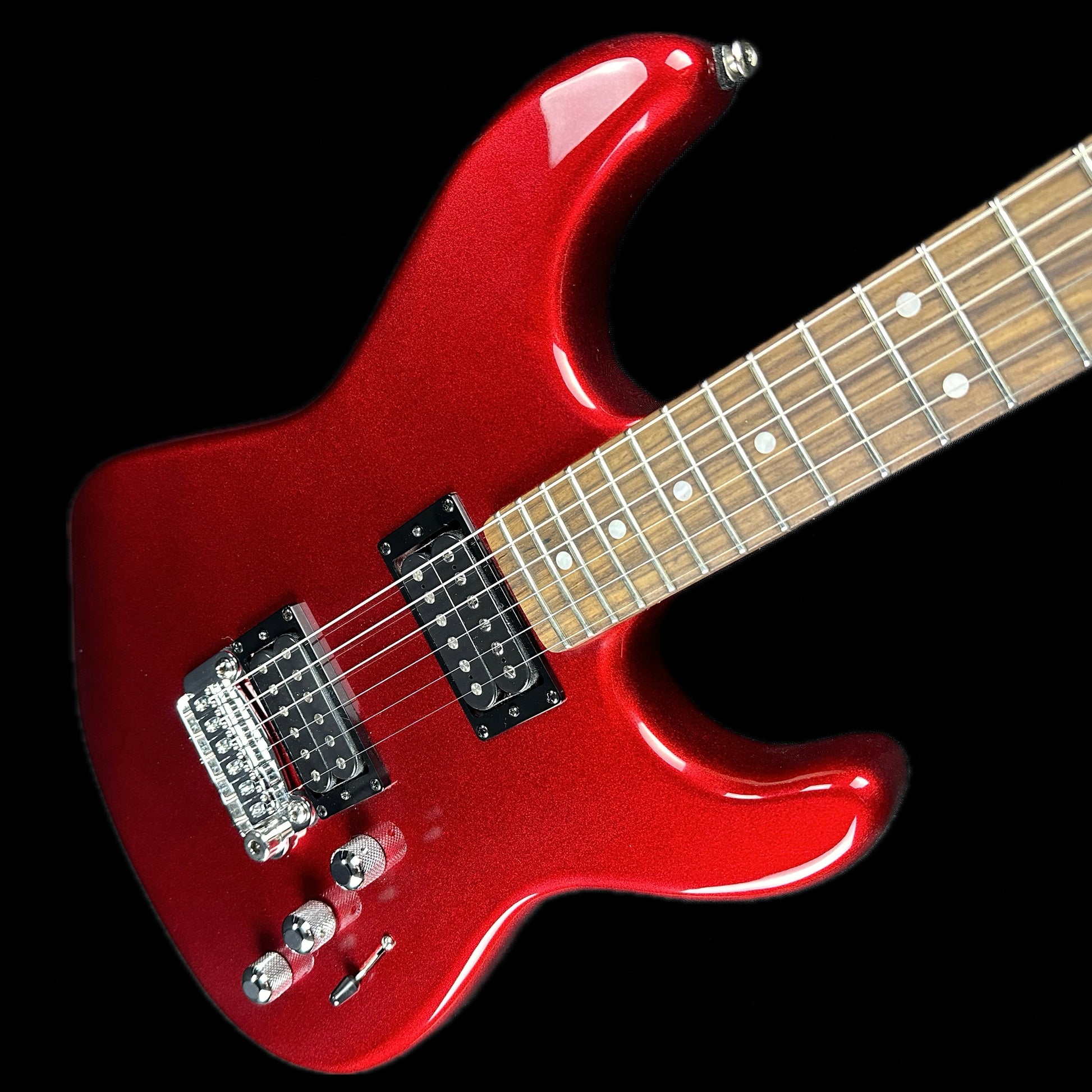 Front angle of G&L USA Legacy HH RMC Empress Candy Apple Red Metallic Matching Headstock.