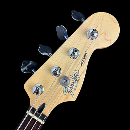 Front of headstock of Used Fender Standard Jazz Bass Black.