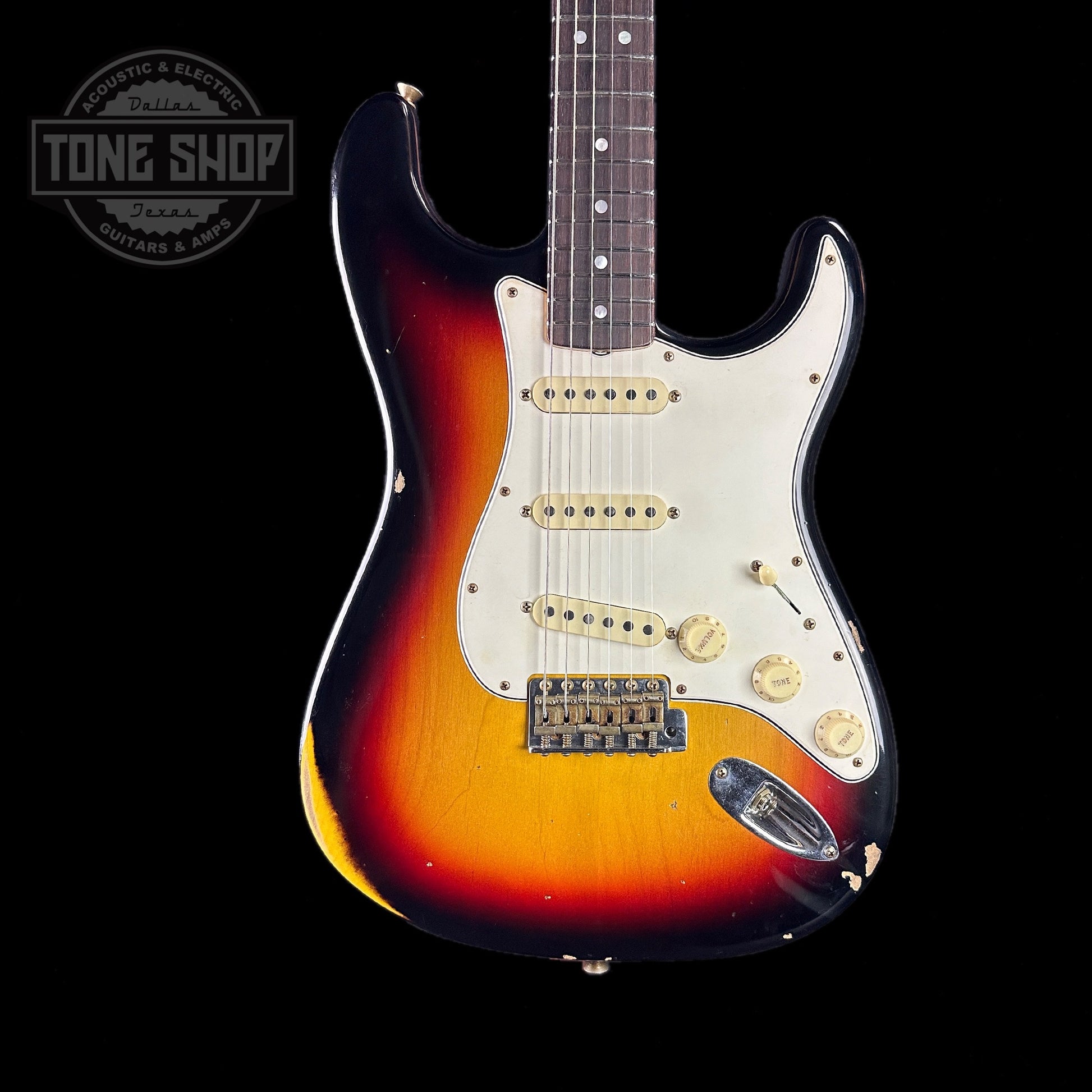 Front of body of Fender Custom Shop Limited Edition Late 64 Strat Relic Target 3 Color Sunburst.