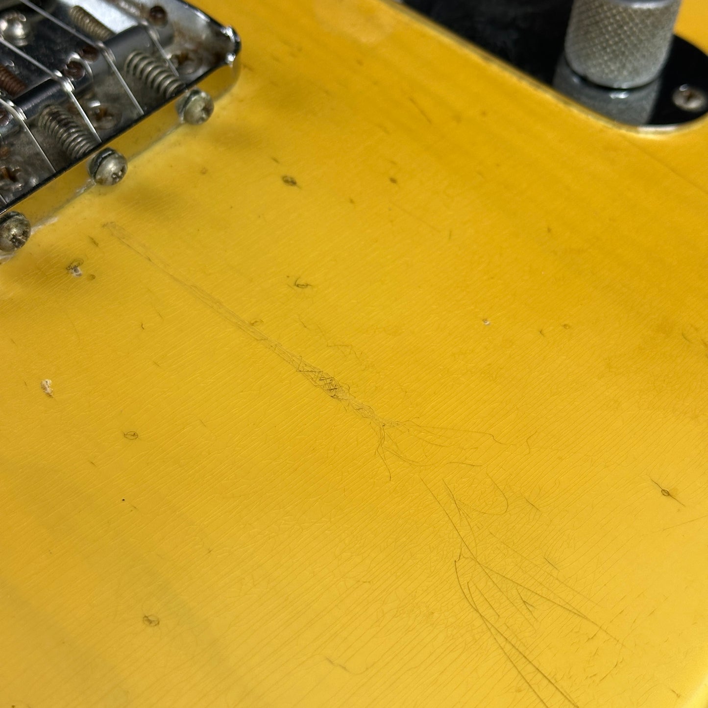 Damage near bridge of Vintage 1974 Fender Telecaster.