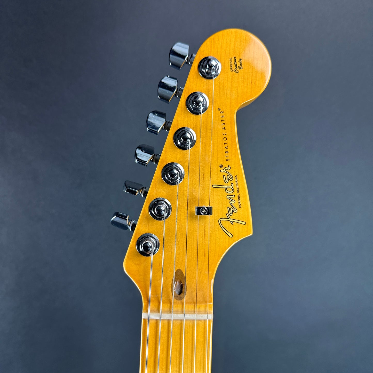 Front of headstock of Used 2023 Fender American Pro II Stratocaster Maple 2 Tone Sunburst.