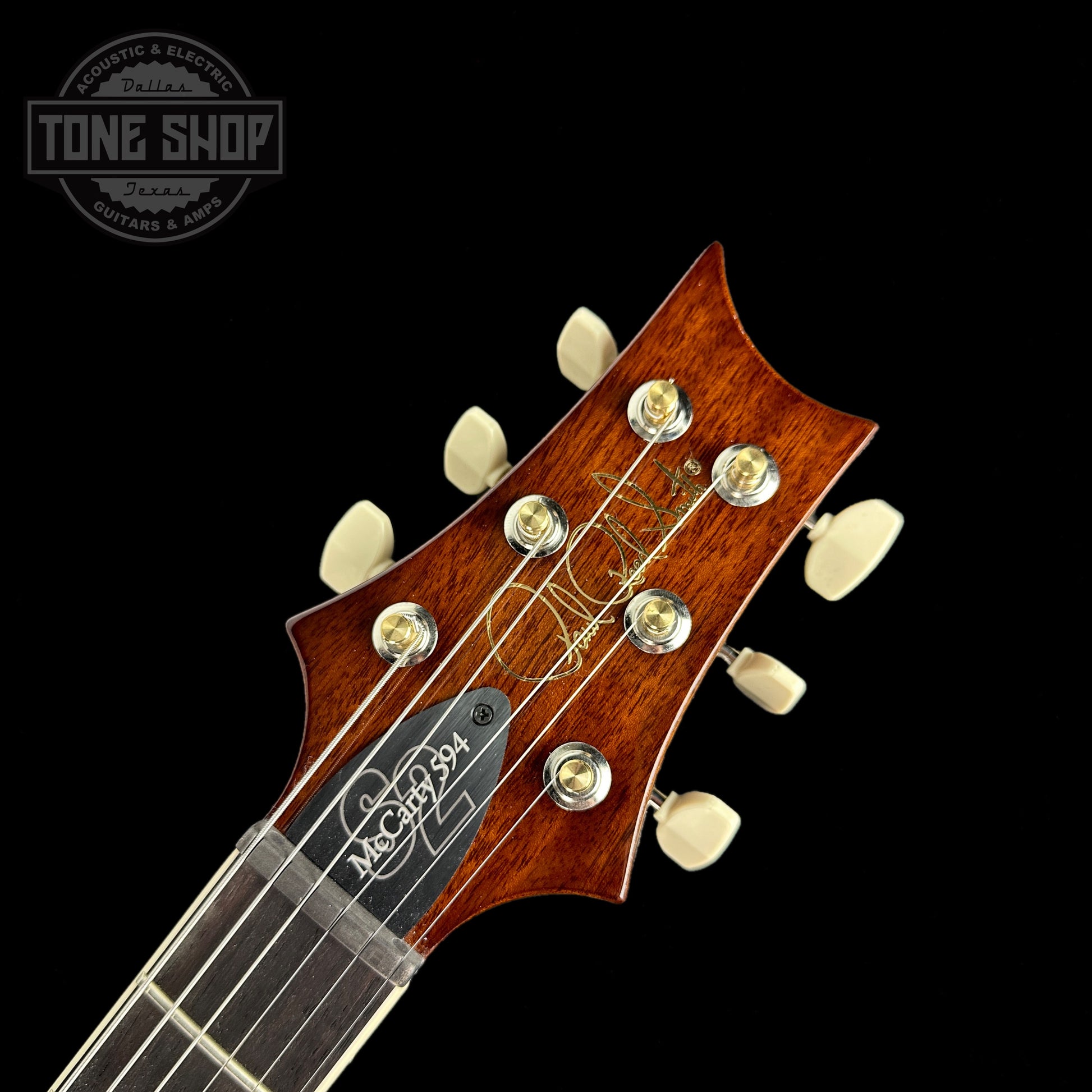 Front of headstock of PRS S2 McCarty 594 Flame Top Honey.