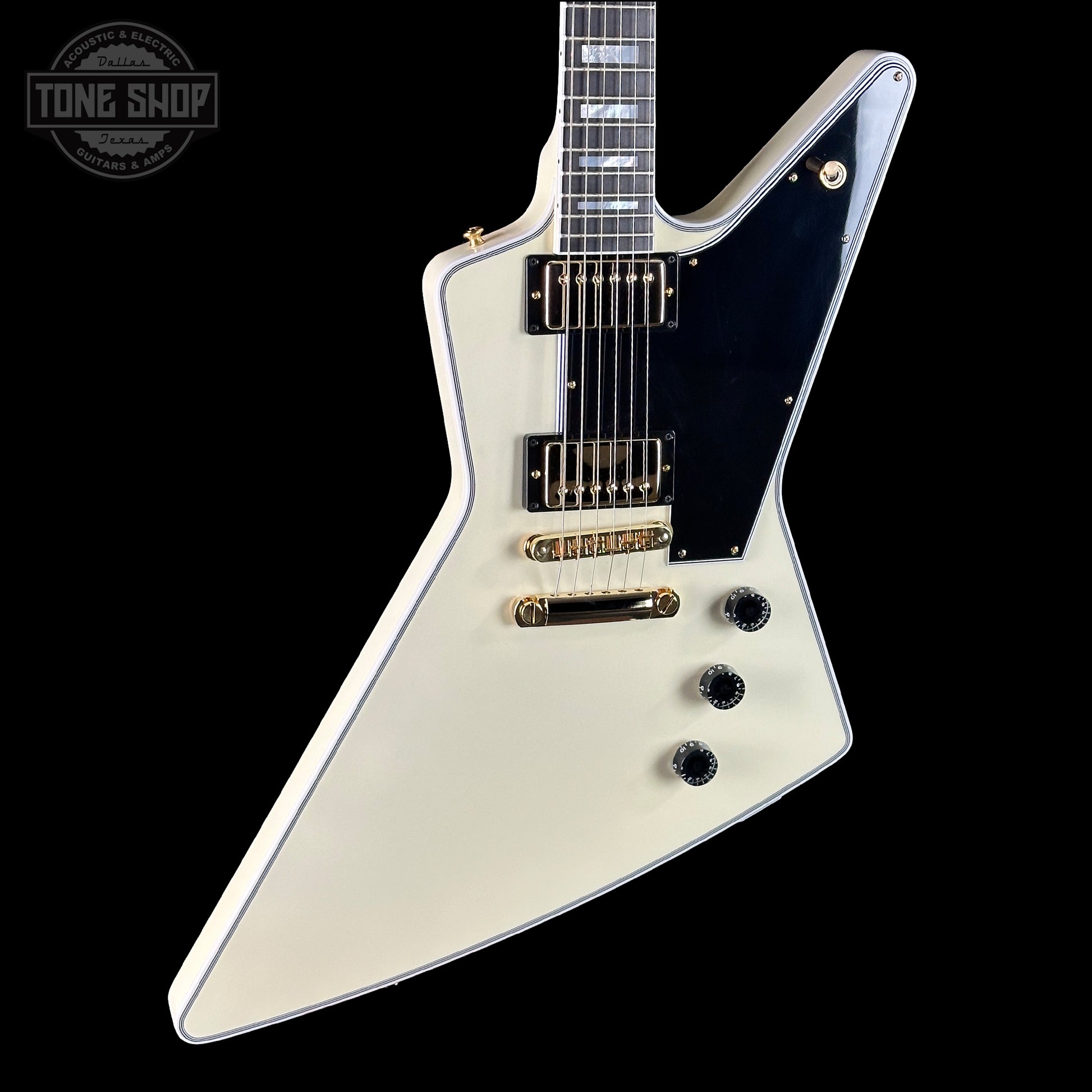 White electric guitar with a black pickguard on a white background, featuring the Tone Shop logo.