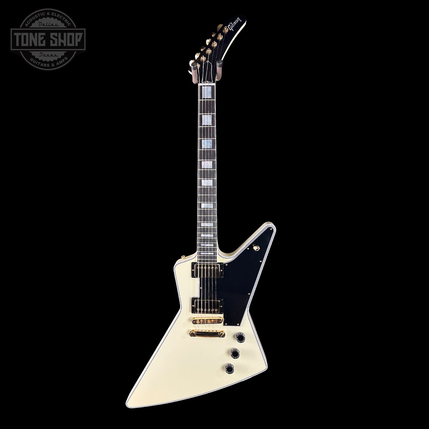 White electric guitar with black pickguard on a white background, featuring 'Tone Shop' logo.