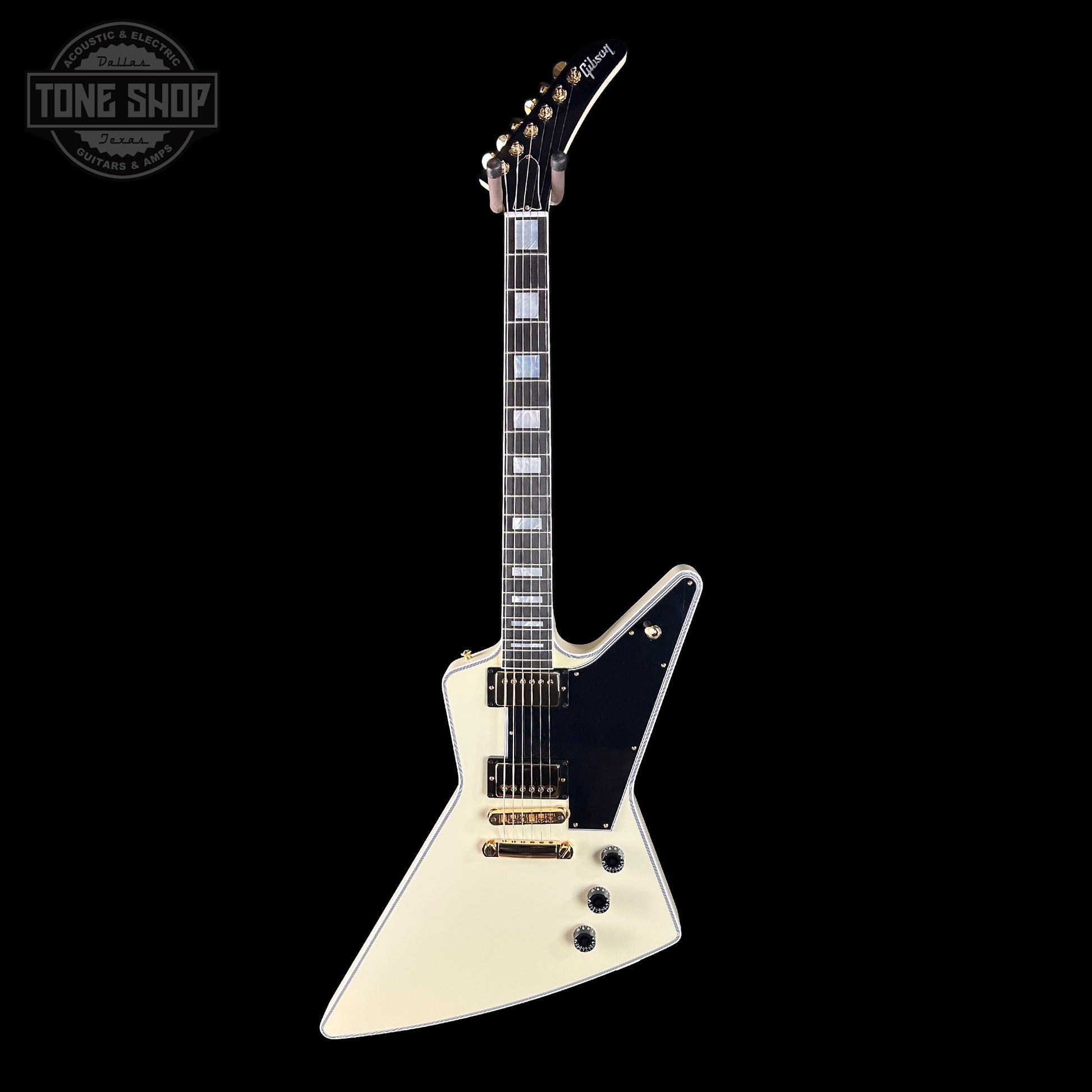 White electric guitar with black pickguard on a white background, featuring 'Tone Shop' logo.