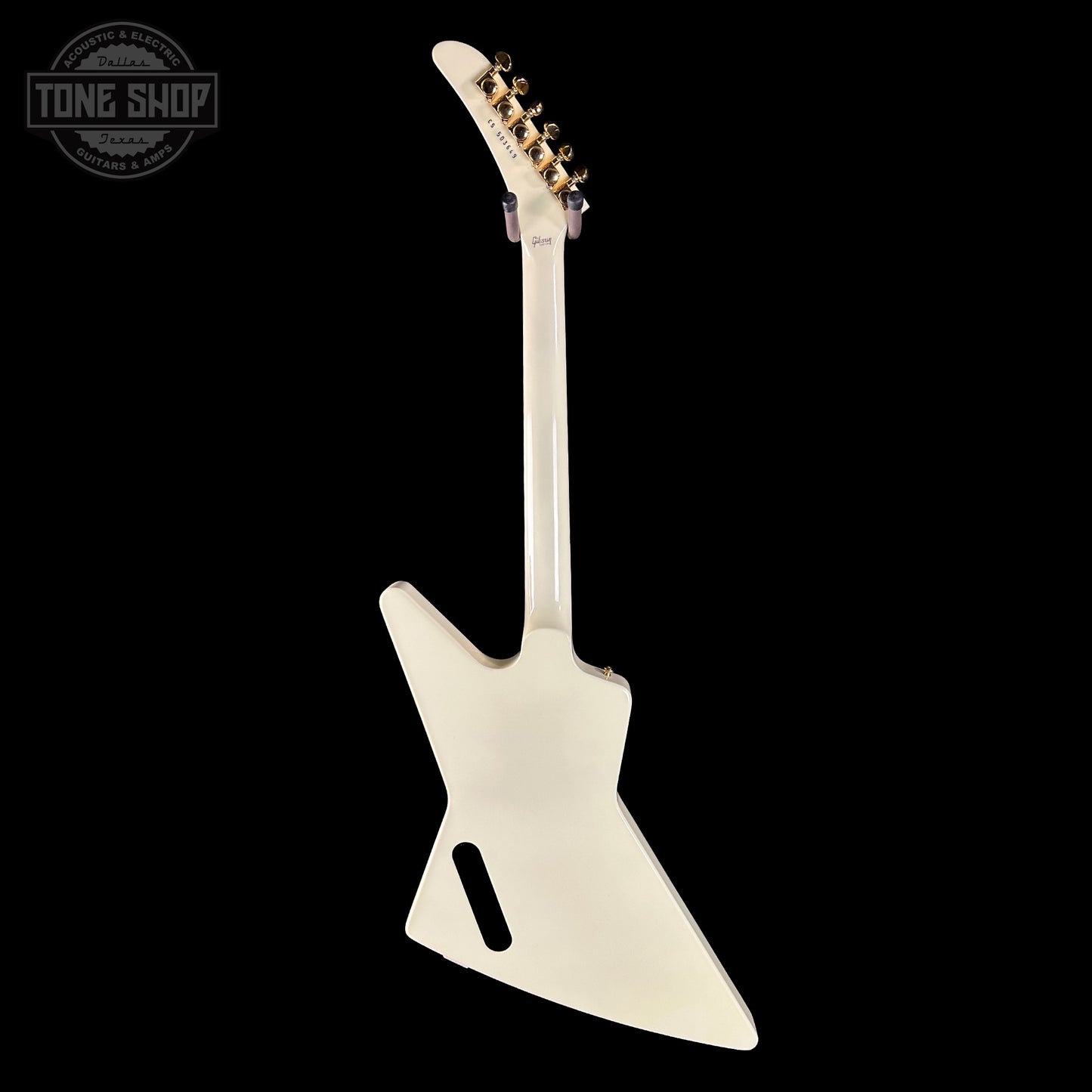 White electric guitar on a black background with 'Tone Shop' logo.