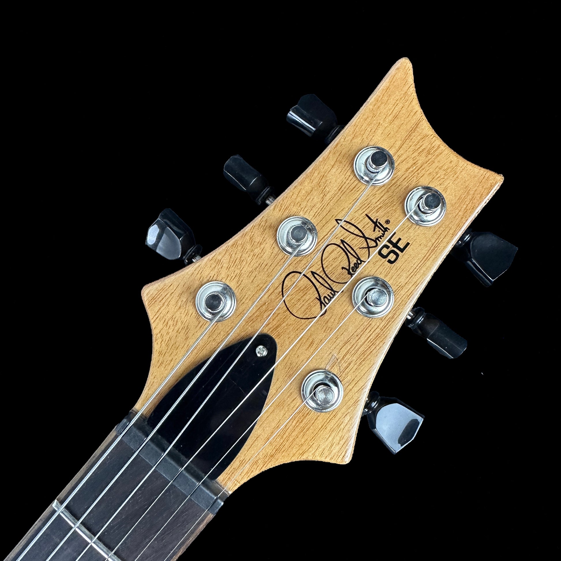 Front of headstock of Used PRS SE Paul's Guitar DC Faded Blueburst PGDC.
