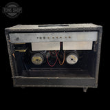 Vintage guitar amplifier with visible brand logo on a black background