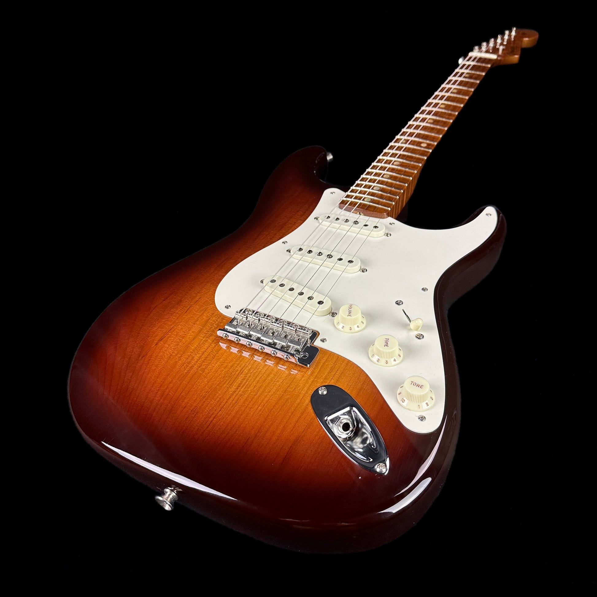 Front angle of Fender Custom Shop Limited Edition Roasted Pine Chocolate 2 Tone Sunburst.