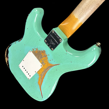 Back angle of Fender Custom Shop Limited Edition '62 Strat Heavy Relic Faded Aged Sea Foam Green Over 3 Color Sunburst.