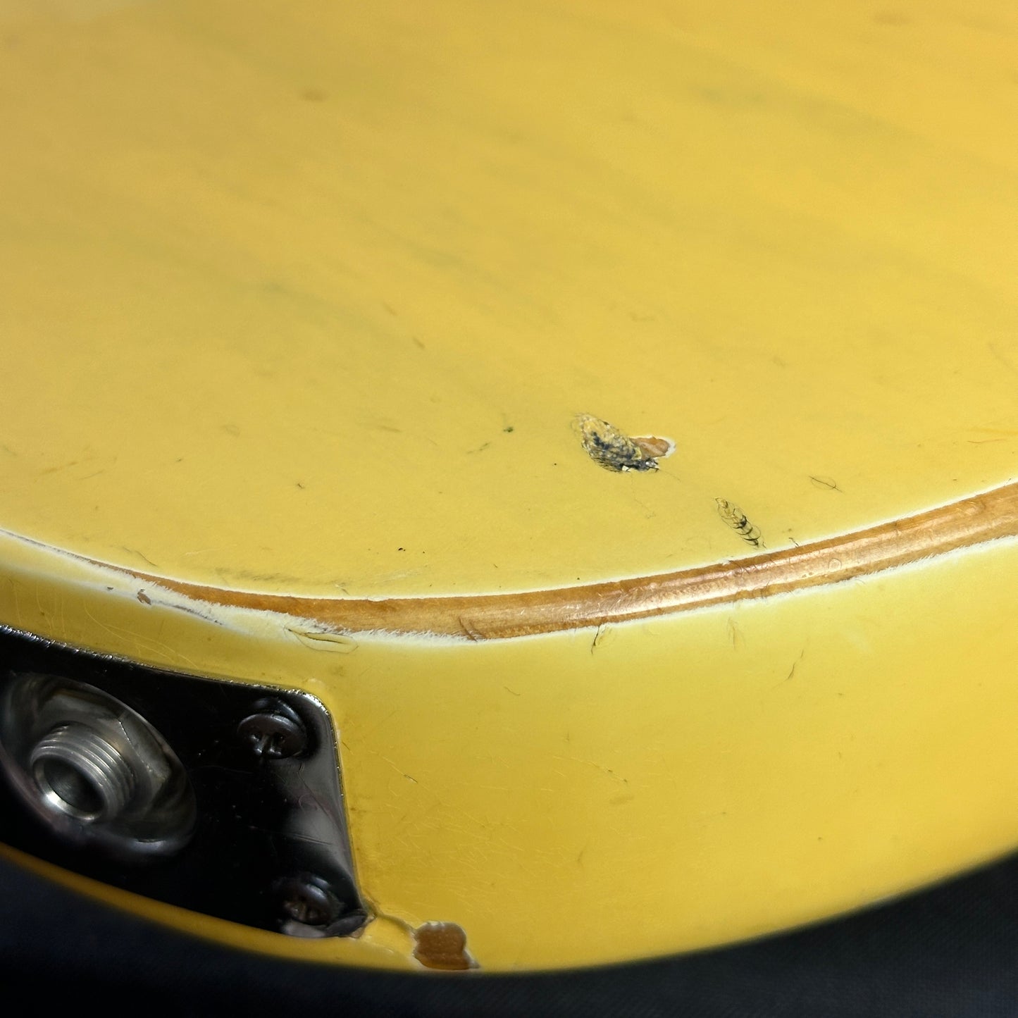 Damage near output jack of Vintage 1974 Fender Telecaster.