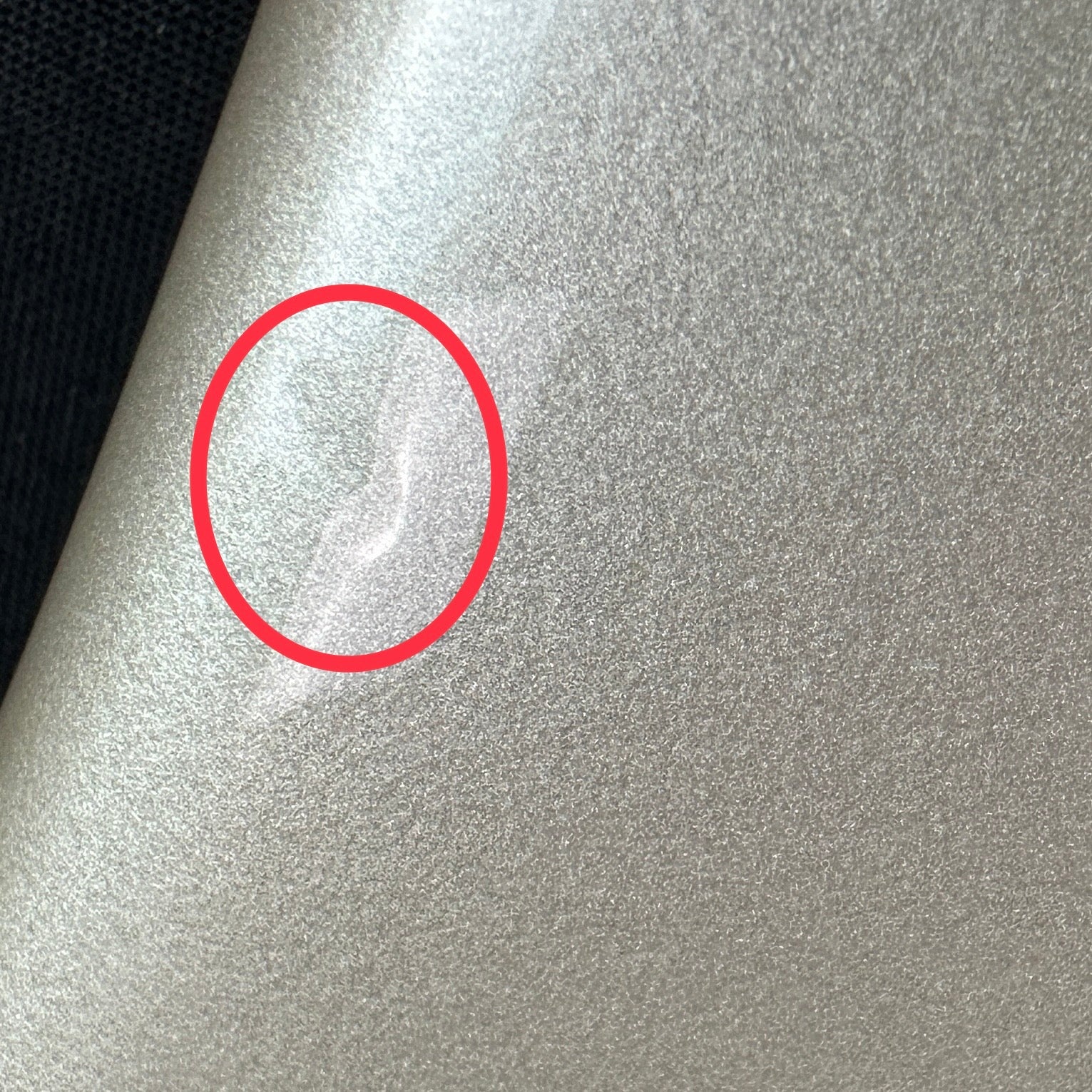 Small dent near edge on front of body.