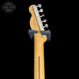 Guitar headstock with tuning pegs on a black background, featuring 'Tone Shop' logo.