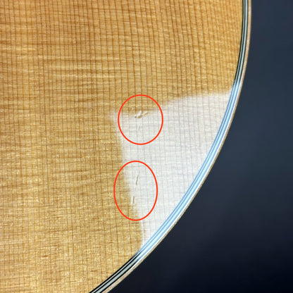 Damage on front of Used 2008 Taylor 814ce.