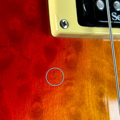 Small ding near pickups of Used Epiphone Les Paul Standard Cherry Burst.