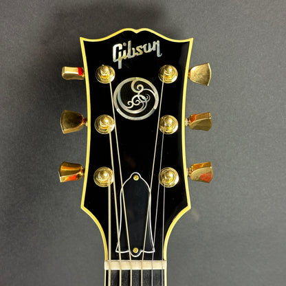 Front of headstock of Used 2021 Gibson Orianthi SJ-200 Trans Red.