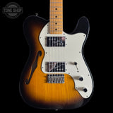 Electric guitar with a sunburst finish on a black background, featuring the Tone Shop logo.