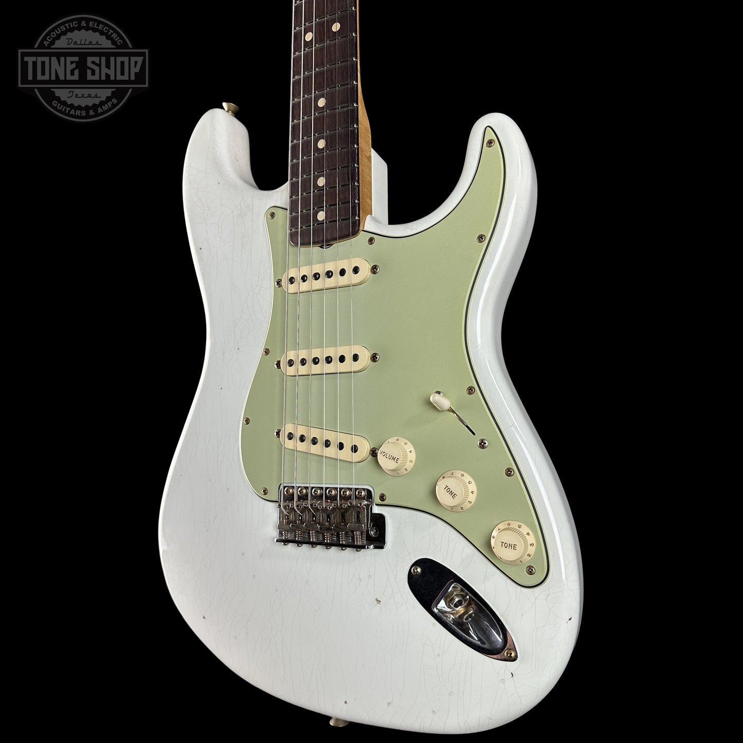 Front right angle of Fender Custom Shop 1963 Stratocaster Journeyman Relic Olympic White AAA Maple Neck.