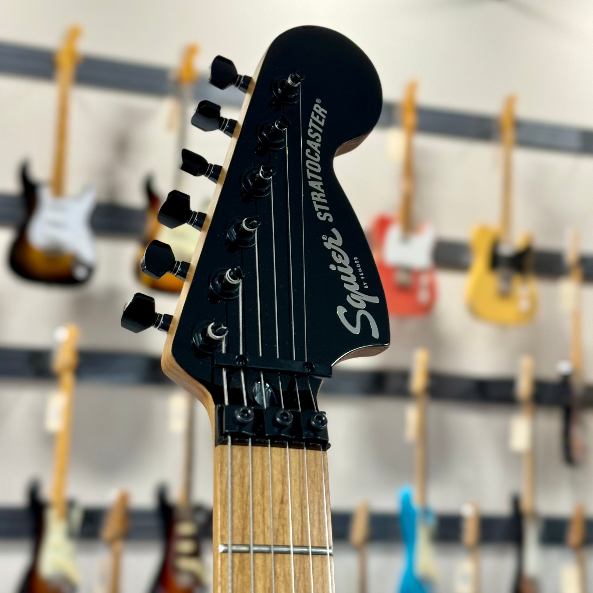 Close up of headstock of Used Squier Contemporary Statocaster HH FR TSS3995