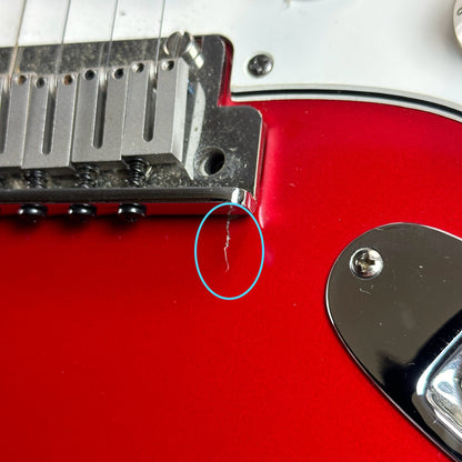 Crack under Used 1992 Fender USA Strat Red.