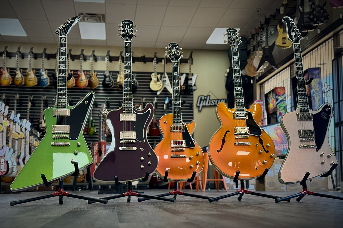 Group of color shifting guitars in a guitar shop.