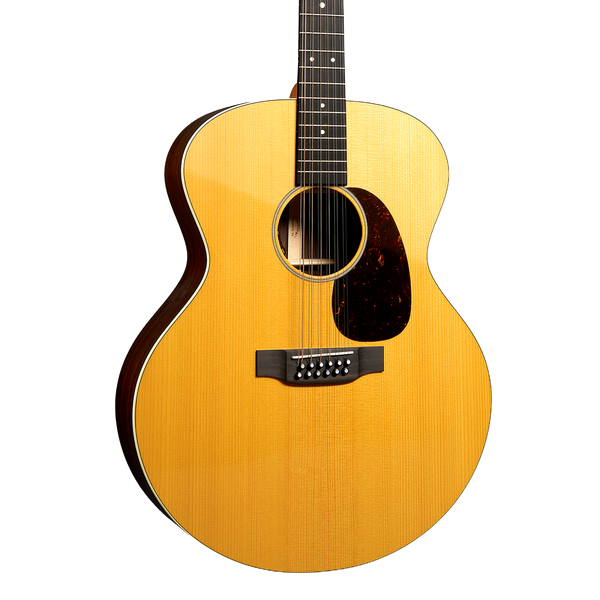 A Martin Grand J-16E 12 String acoustic guitar with a natural wood finish, dark brown sides and headstock, and a black pickguard, shown against a solid white background.