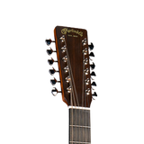 Close-up of a Martin & Co twelve-string guitar headstock and upper neck, showing the dark wood finish, gold script branding, and black tuning pegs against a plain white background.