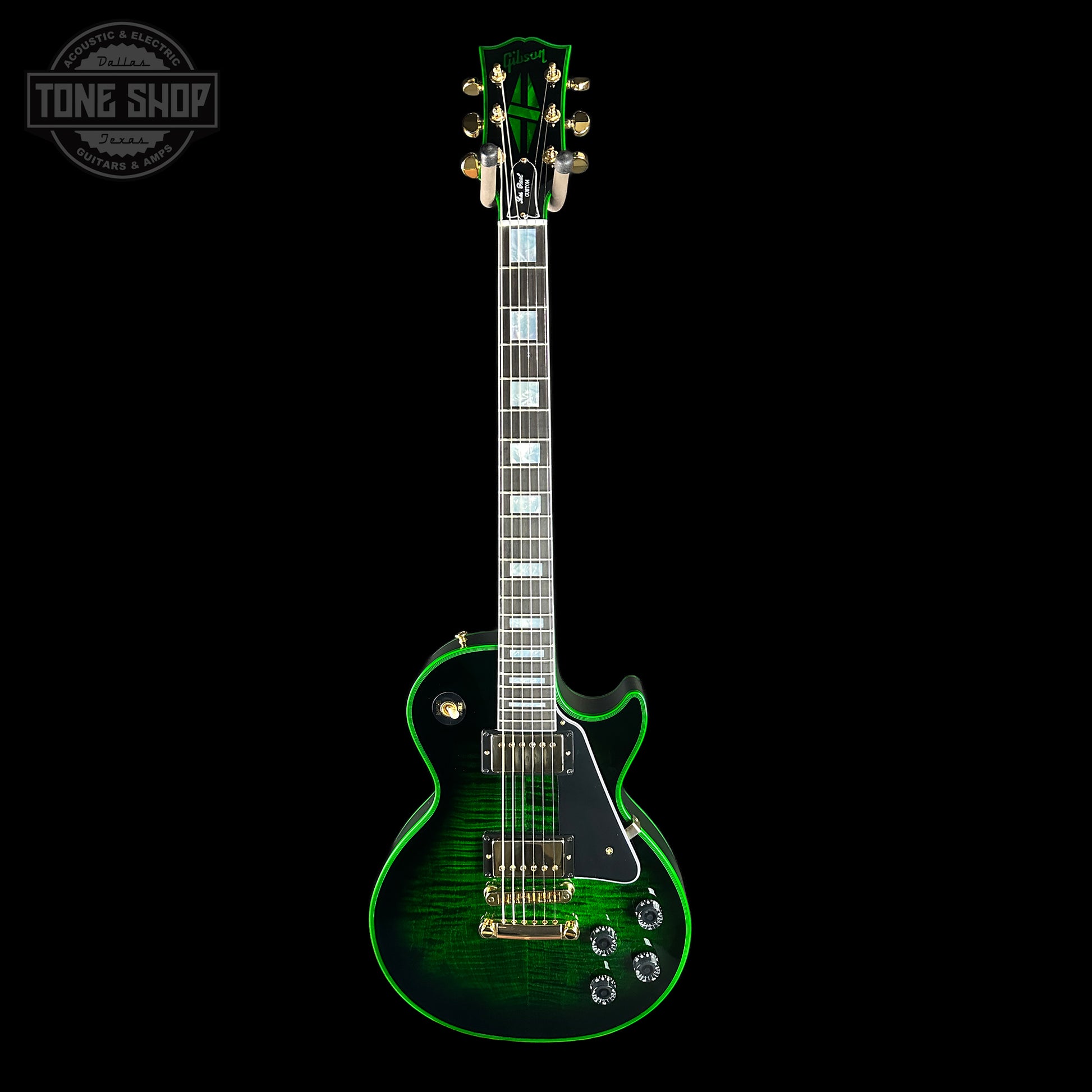 Green electric guitar on a black background with 'Tone Shop' logo.