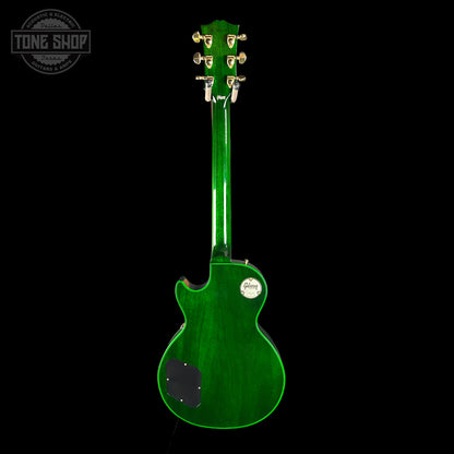 Green electric guitar on a black background with 'Tone Shop' logo.