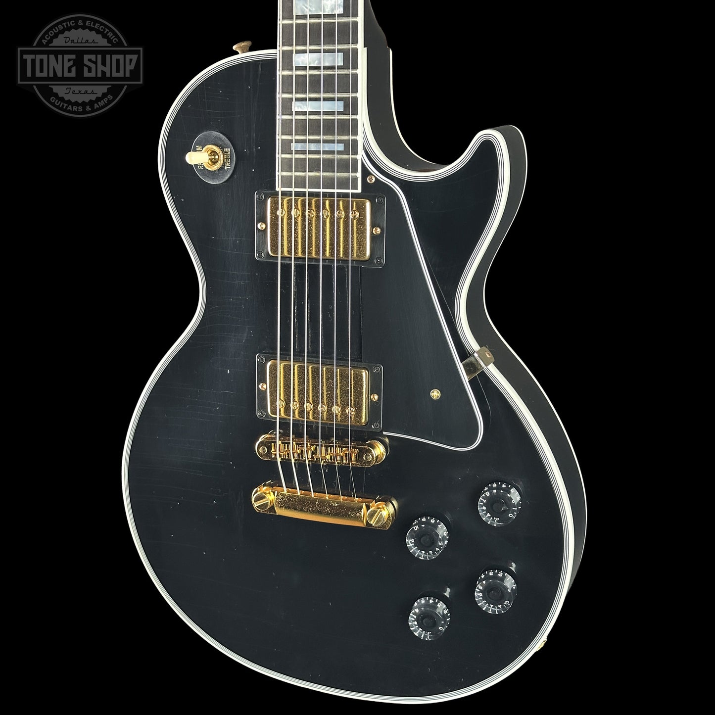Front right angle of Gibson Custom Dealer Select Les Paul Custom Ebony Ultra Light Aged CS502595.